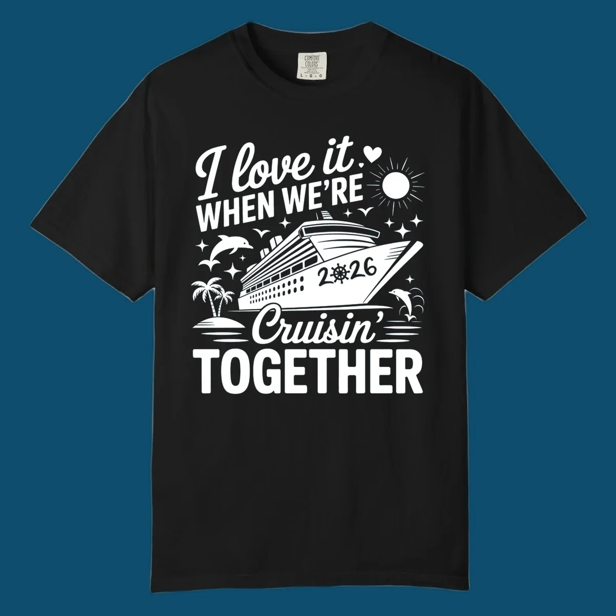 A white and dark blue cruise ship design with "I love it WHEN WE'RE Cruisin' TOGETHER" and "2026", showing dolphins and palm trees, symbolizing a love-cruisin-together-2026 vacation.
