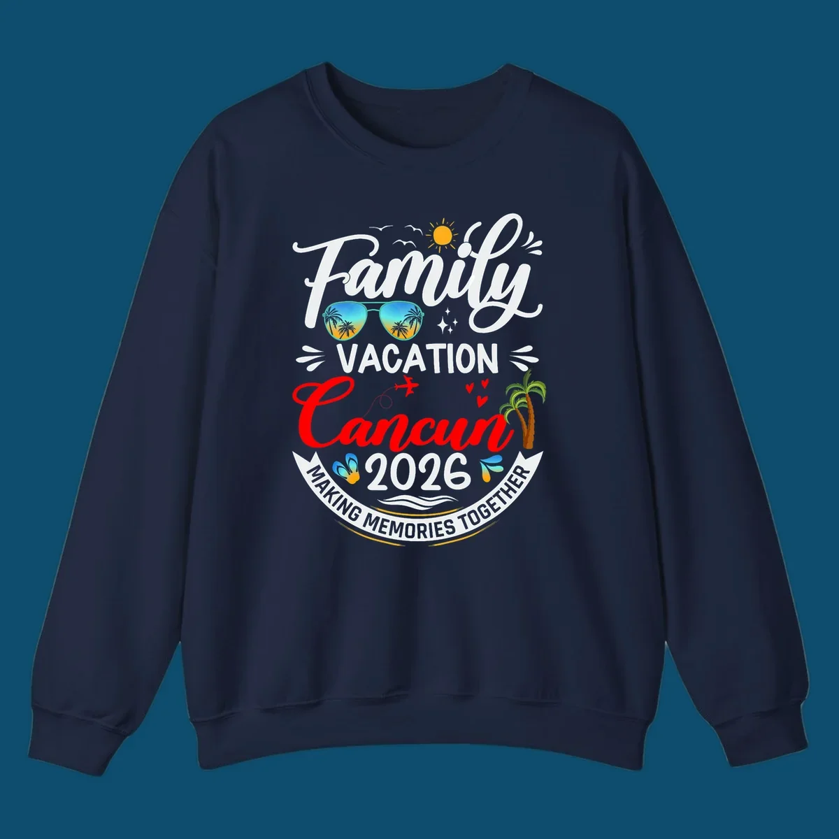 A vibrant "Family Cancun Vacation 2026" t-shirt design with a sun, birds, sunglasses, airplane, hearts, and palm trees.