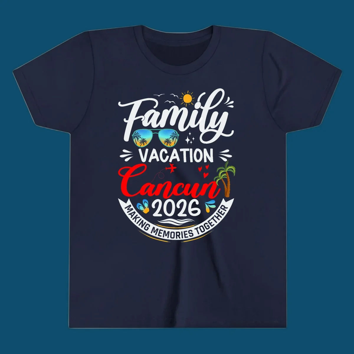 A vibrant "Family Cancun Vacation 2026" t-shirt design with a sun, birds, sunglasses, airplane, hearts, and palm trees.
