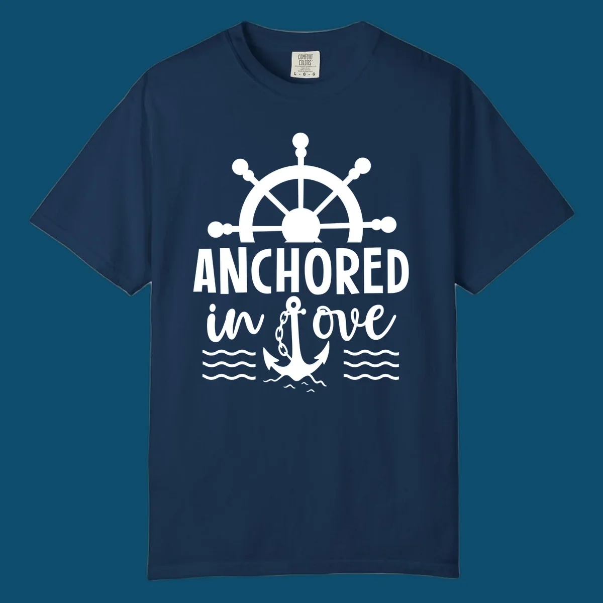 A 'Anchored in love cruise' design with a ship's wheel, the text ANCHORED in love, an anchor, and ocean waves.