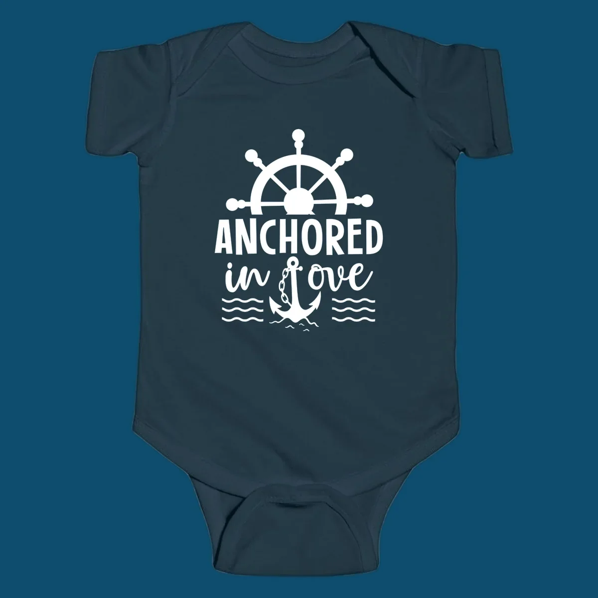 A 'Anchored in love cruise' design with a ship's wheel, the text ANCHORED in love, an anchor, and ocean waves.