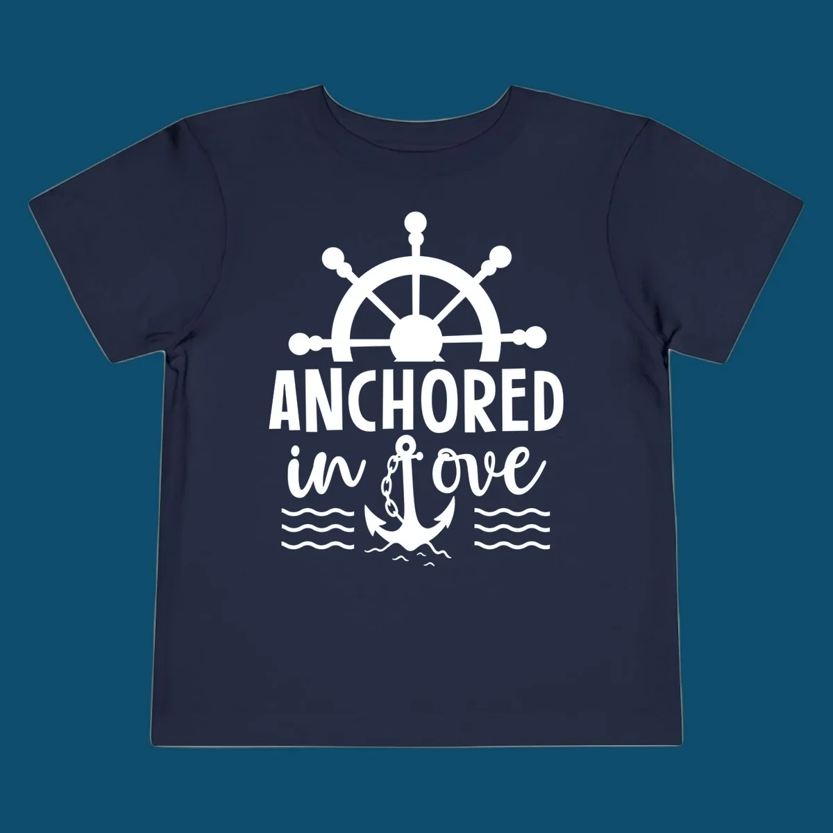 A 'Anchored in love cruise' design with a ship's wheel, the text ANCHORED in love, an anchor, and ocean waves.
