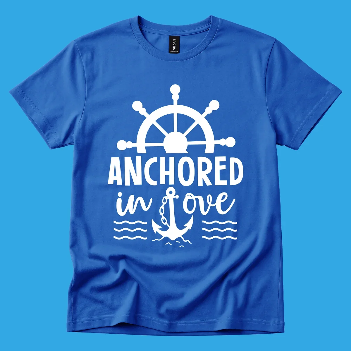 A 'Anchored in love cruise' design with a ship's wheel, the text ANCHORED in love, an anchor, and ocean waves.
