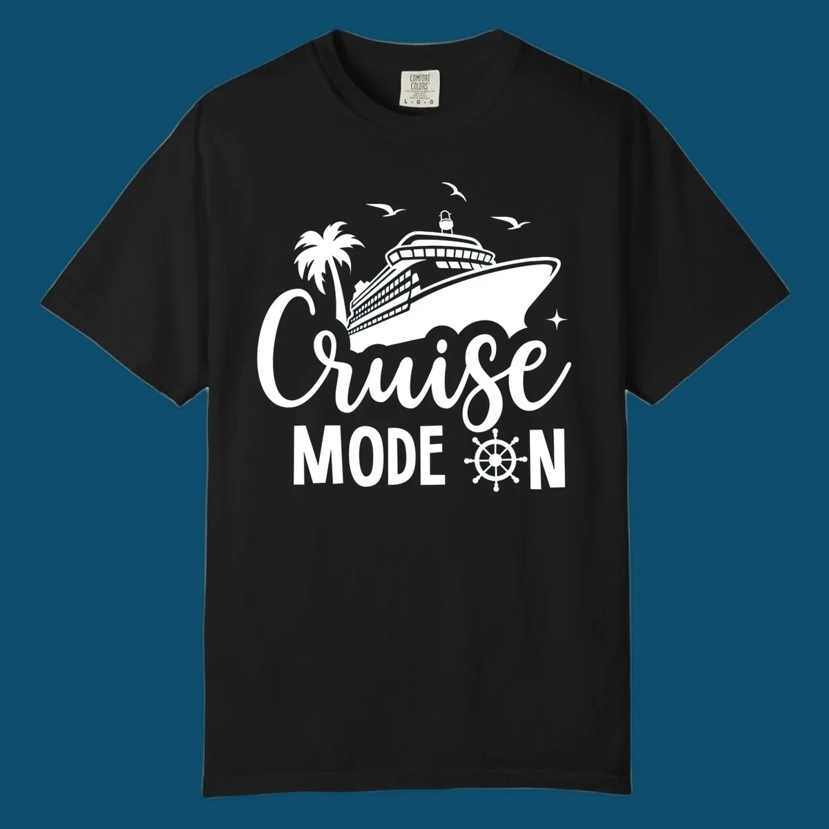 A graphic of a cruise ship, palm tree, and seagulls above the text 'Cruise MODE ON' with a ship's wheel. This is a cruise-mode-on-ship design.