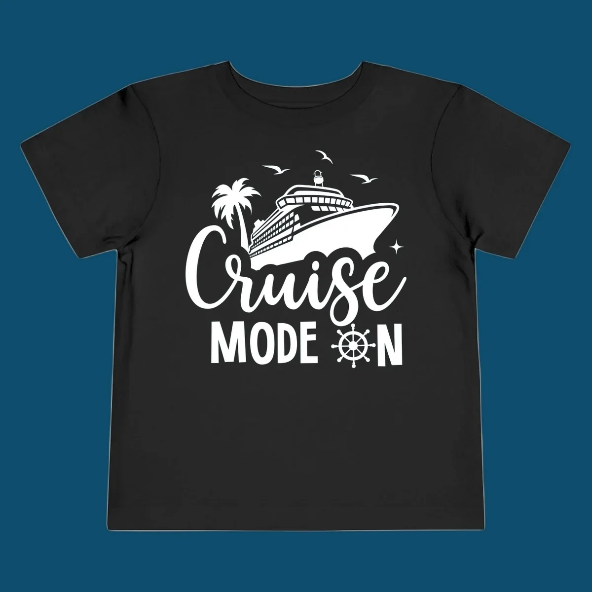 A graphic of a cruise ship, palm tree, and seagulls above the text 'Cruise MODE ON' with a ship's wheel. This is a cruise-mode-on-ship design.