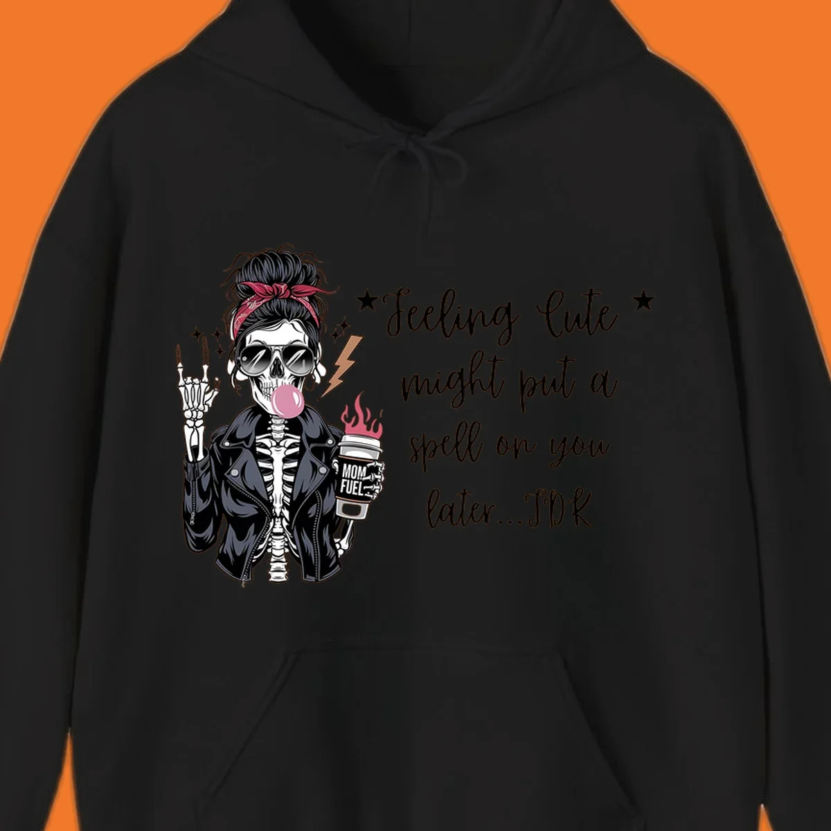 Skeleton mom blowing bubble gum with 'Mom Fuel' coffee, text 'Feeling Cute might put a spell on you later...IDK', halloween graphic.