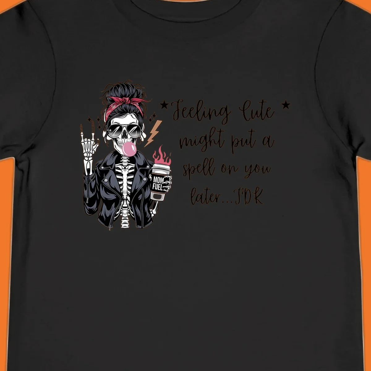 Skeleton mom blowing bubble gum with 'Mom Fuel' coffee, text 'Feeling Cute might put a spell on you later...IDK', halloween graphic.
