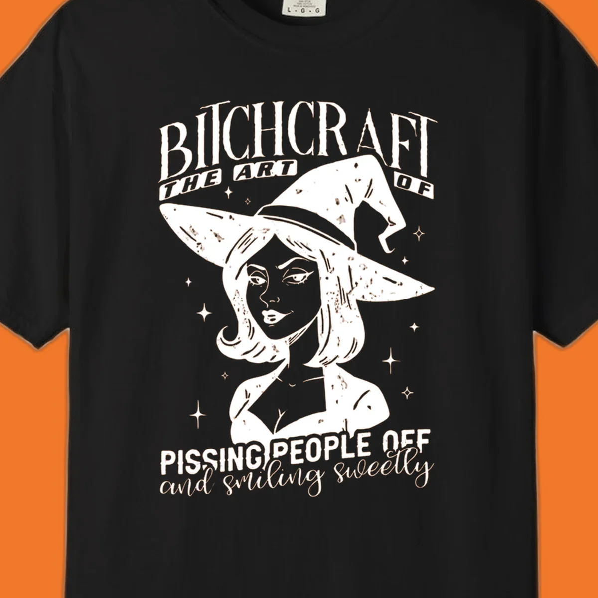 Illustration of a witch with the text Bitchcraft The Art Of Pissing People Off and smiling sweetly.