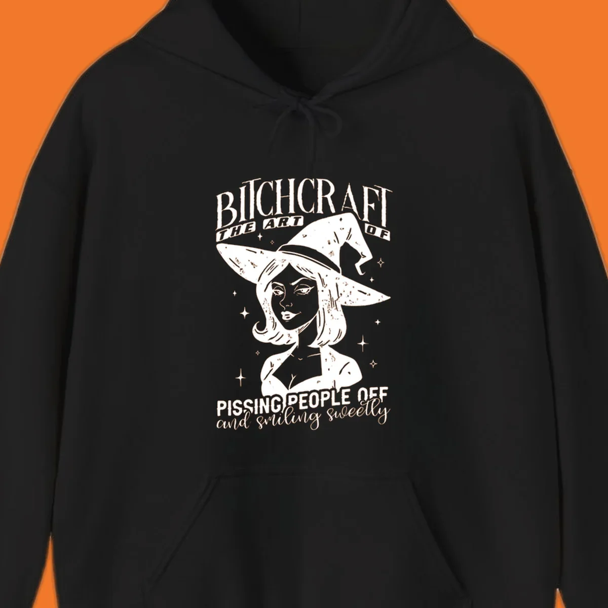 Illustration of a witch with the text Bitchcraft The Art Of Pissing People Off and smiling sweetly.
