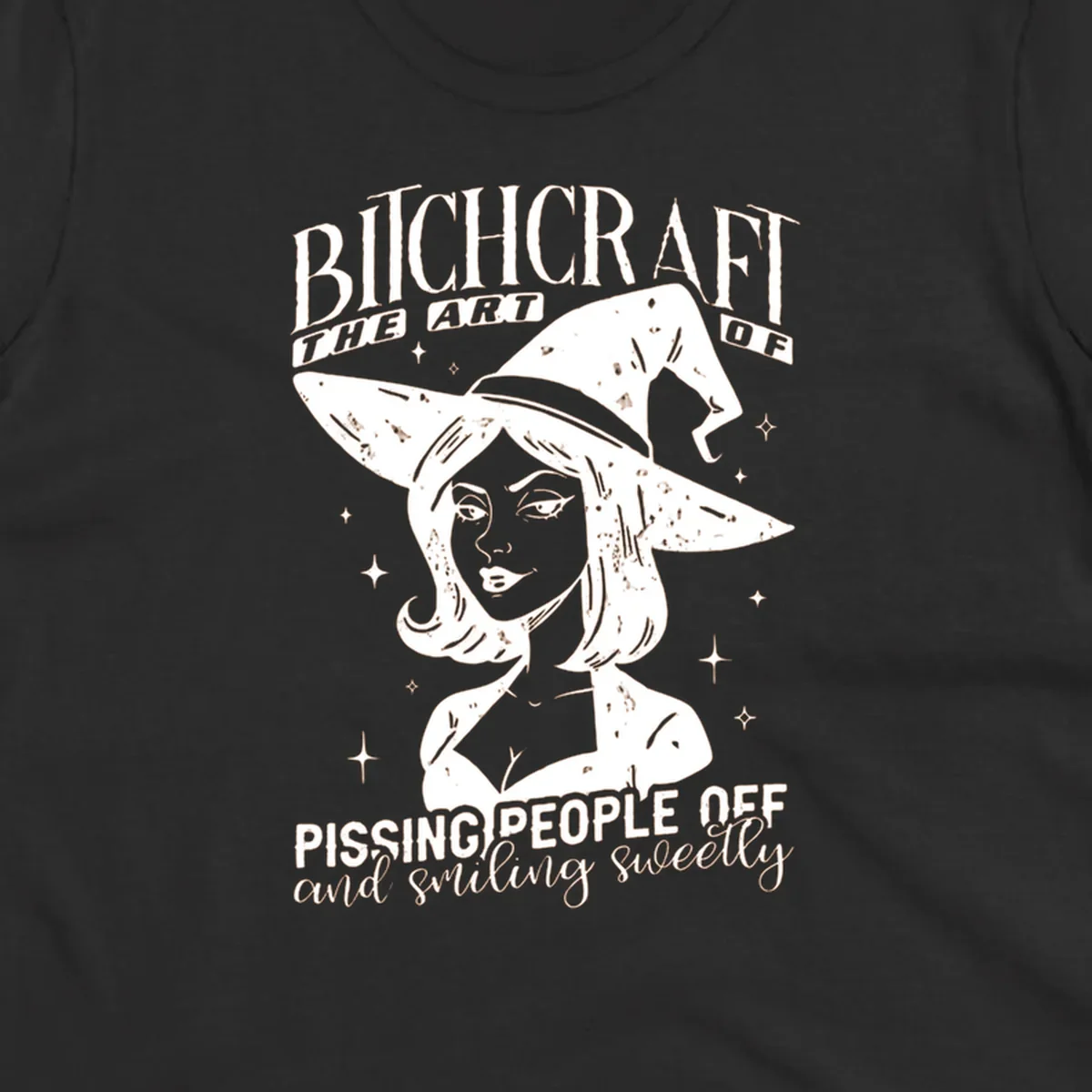 Illustration of a witch with the text Bitchcraft The Art Of Pissing People Off and smiling sweetly.