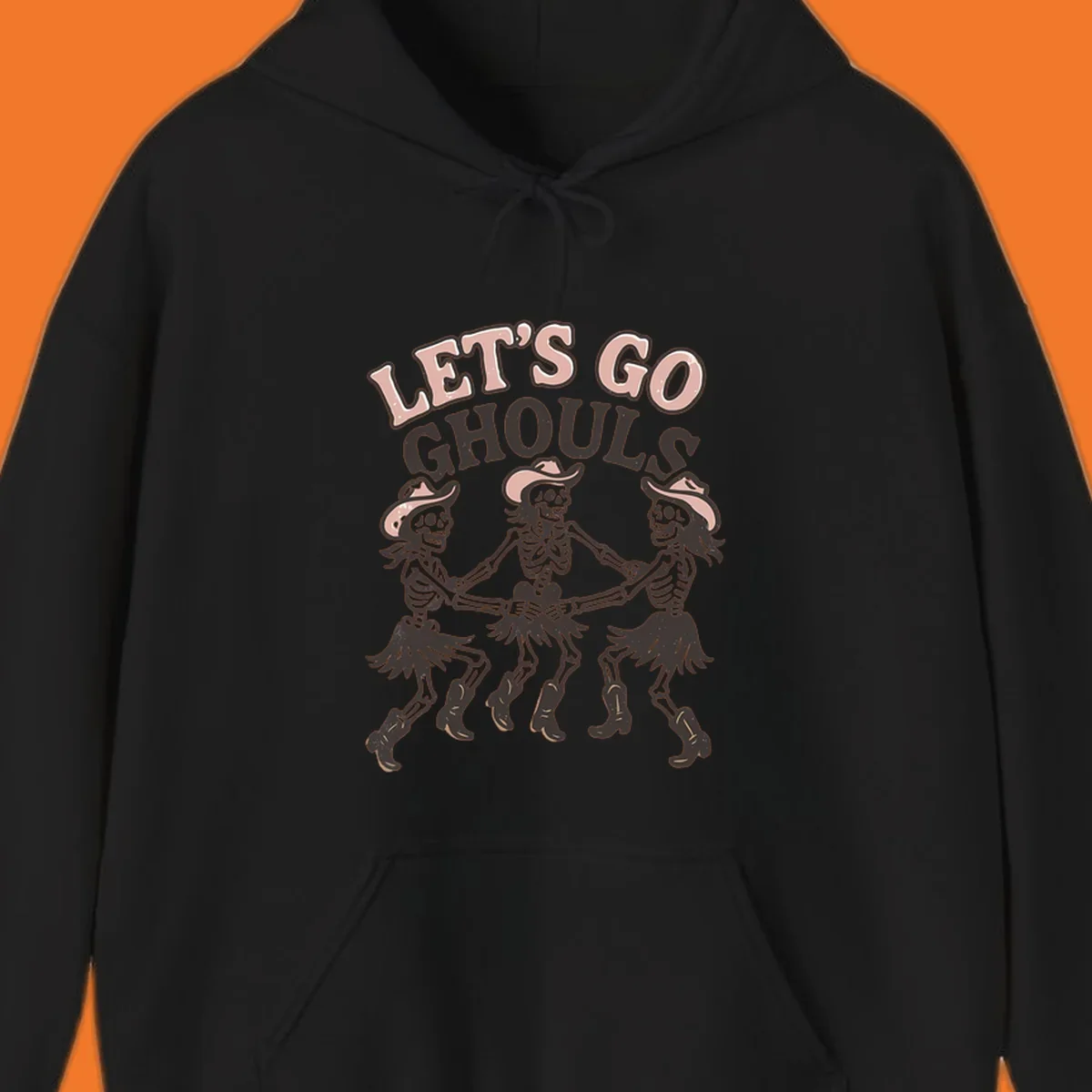 Lets Go Ghouls text with three dancing skeletons in cowboy attire.