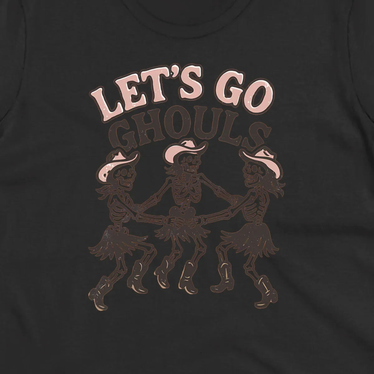 Lets Go Ghouls text with three dancing skeletons in cowboy attire.