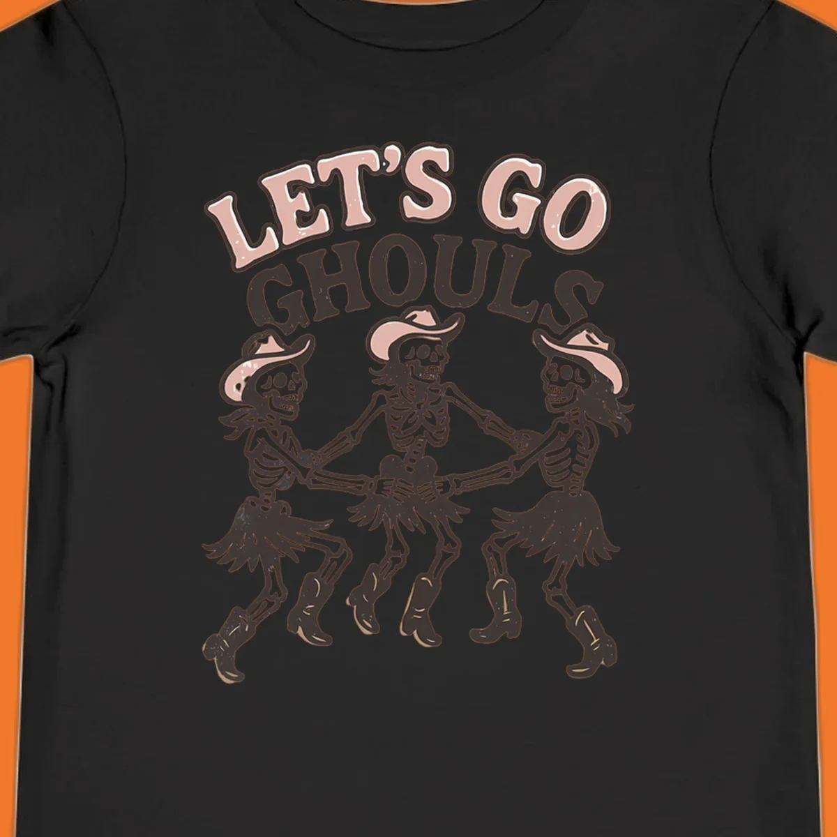 Lets Go Ghouls text with three dancing skeletons in cowboy attire.