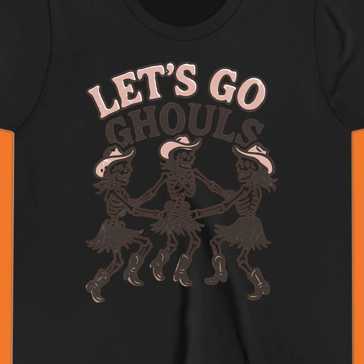 Lets Go Ghouls text with three dancing skeletons in cowboy attire.