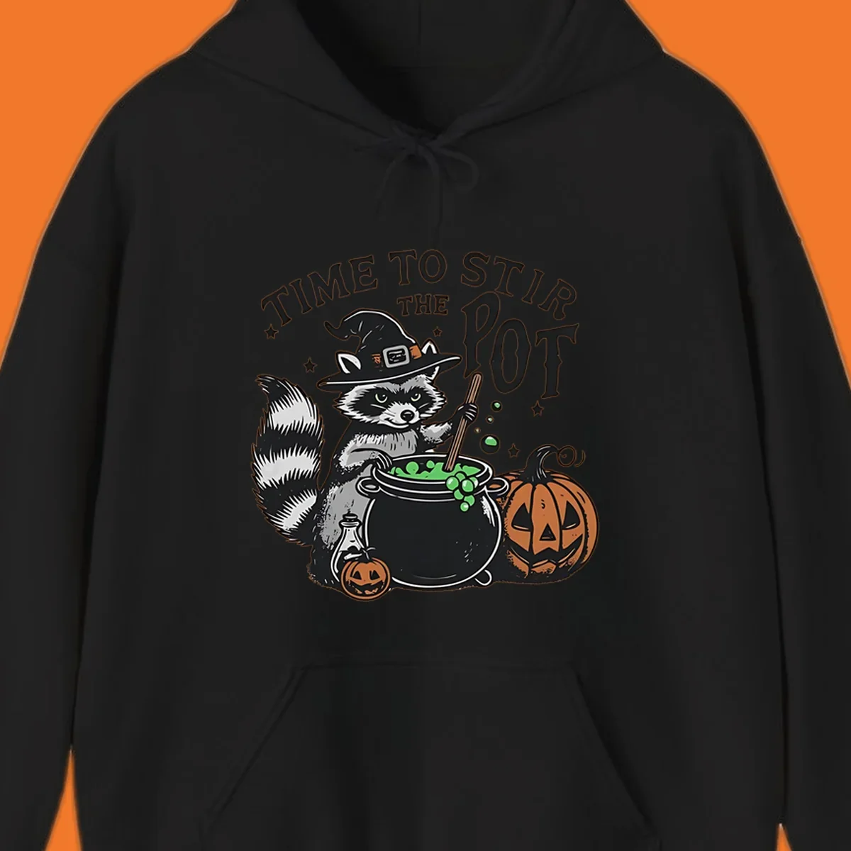 Raccoon witch stirring a halloween pot, text says TIME TO STIR THE POT.