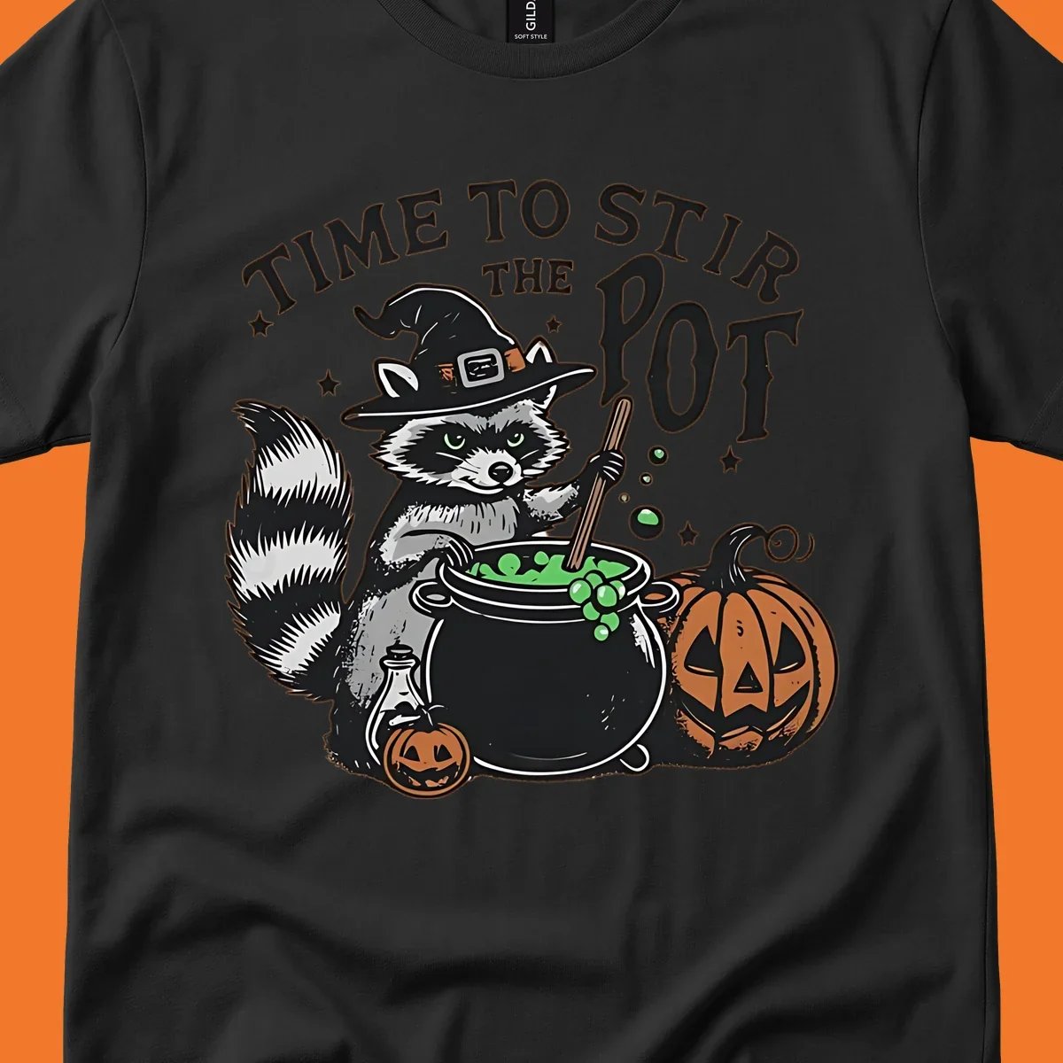 Raccoon witch stirring a halloween pot, text says TIME TO STIR THE POT.