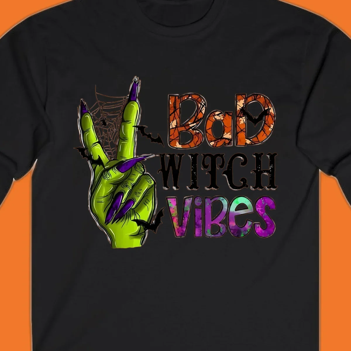 Bad Witch Vibes Halloween graphic with a green witch hand peace sign and bats.