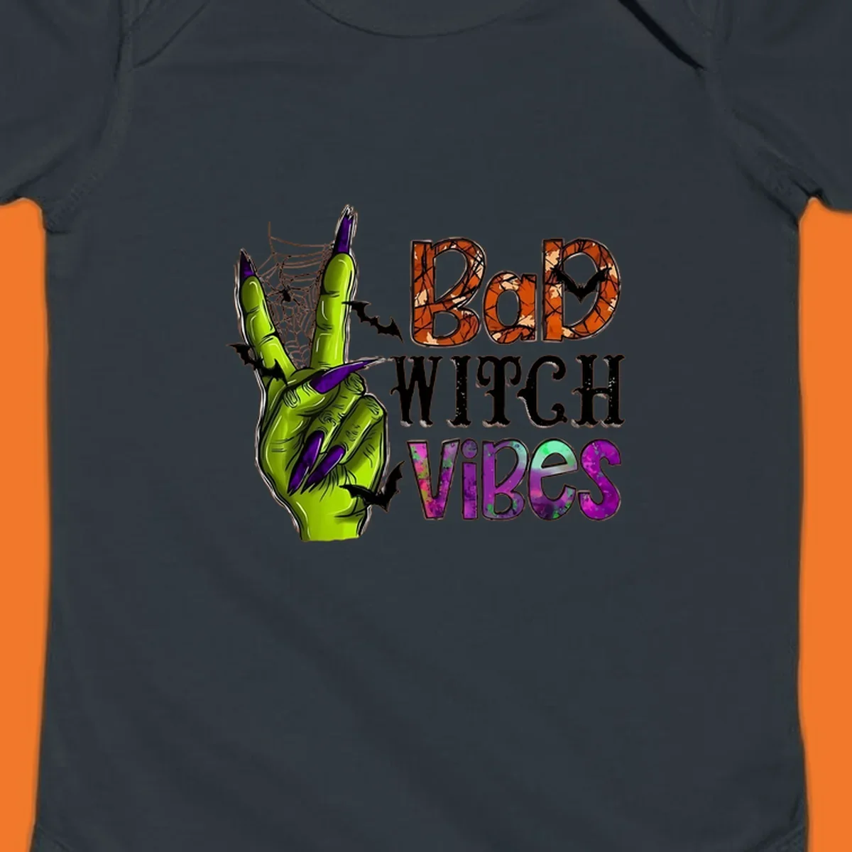 Bad Witch Vibes Halloween graphic with a green witch hand peace sign and bats.