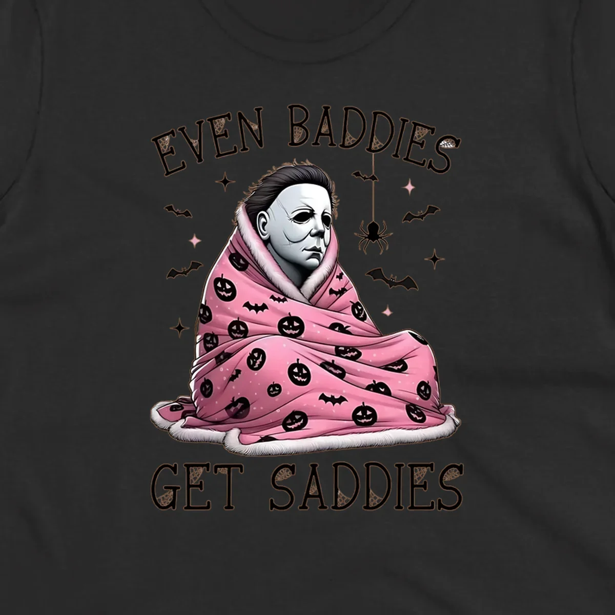 Michael Myers in a pink pumpkin blanket with text 'EVEN BADDIES GET SADDIES', for the michael-myers-cozy concept.