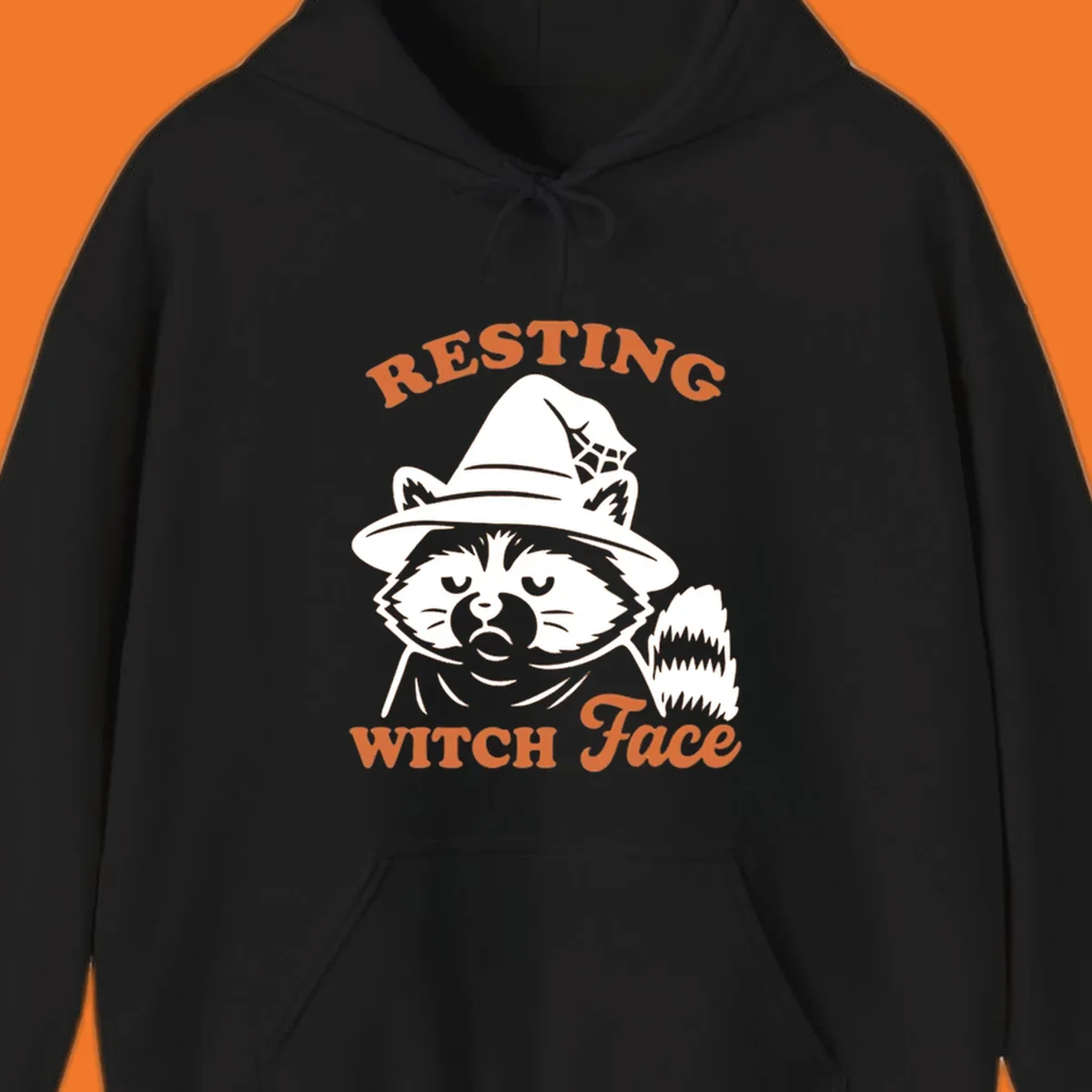 Resting Witch Face raccoon Halloween design with text.