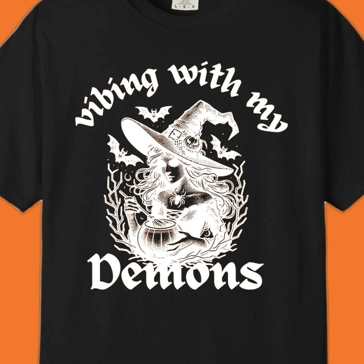 Witch stirring cauldron with bats and text 'vibing with my Demons', witch-vibing-demons design