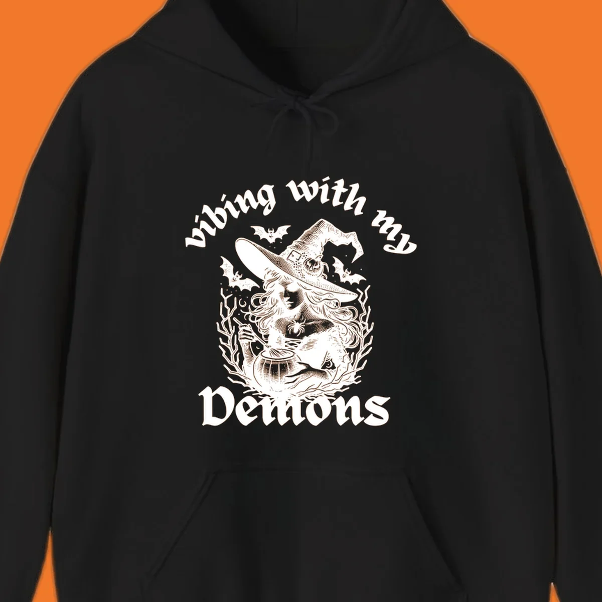 Witch stirring cauldron with bats and text 'vibing with my Demons', witch-vibing-demons design