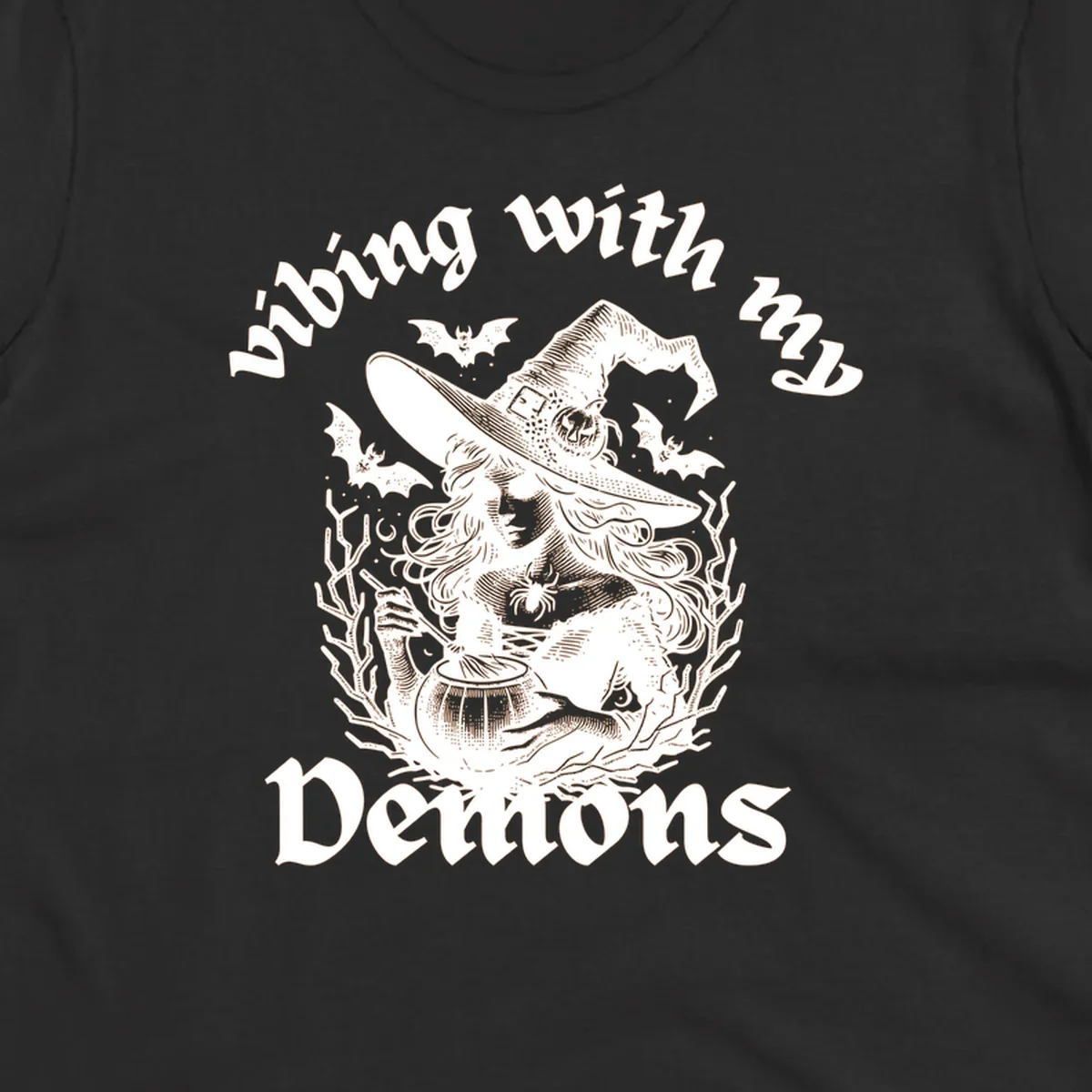 Witch stirring cauldron with bats and text 'vibing with my Demons', witch-vibing-demons design