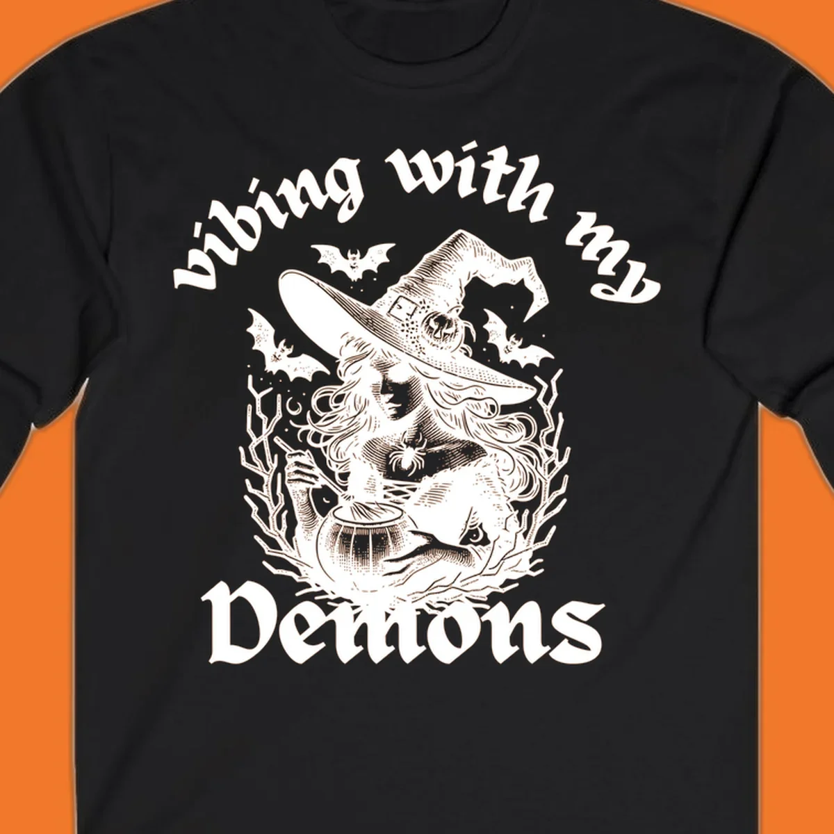 Witch stirring cauldron with bats and text 'vibing with my Demons', witch-vibing-demons design