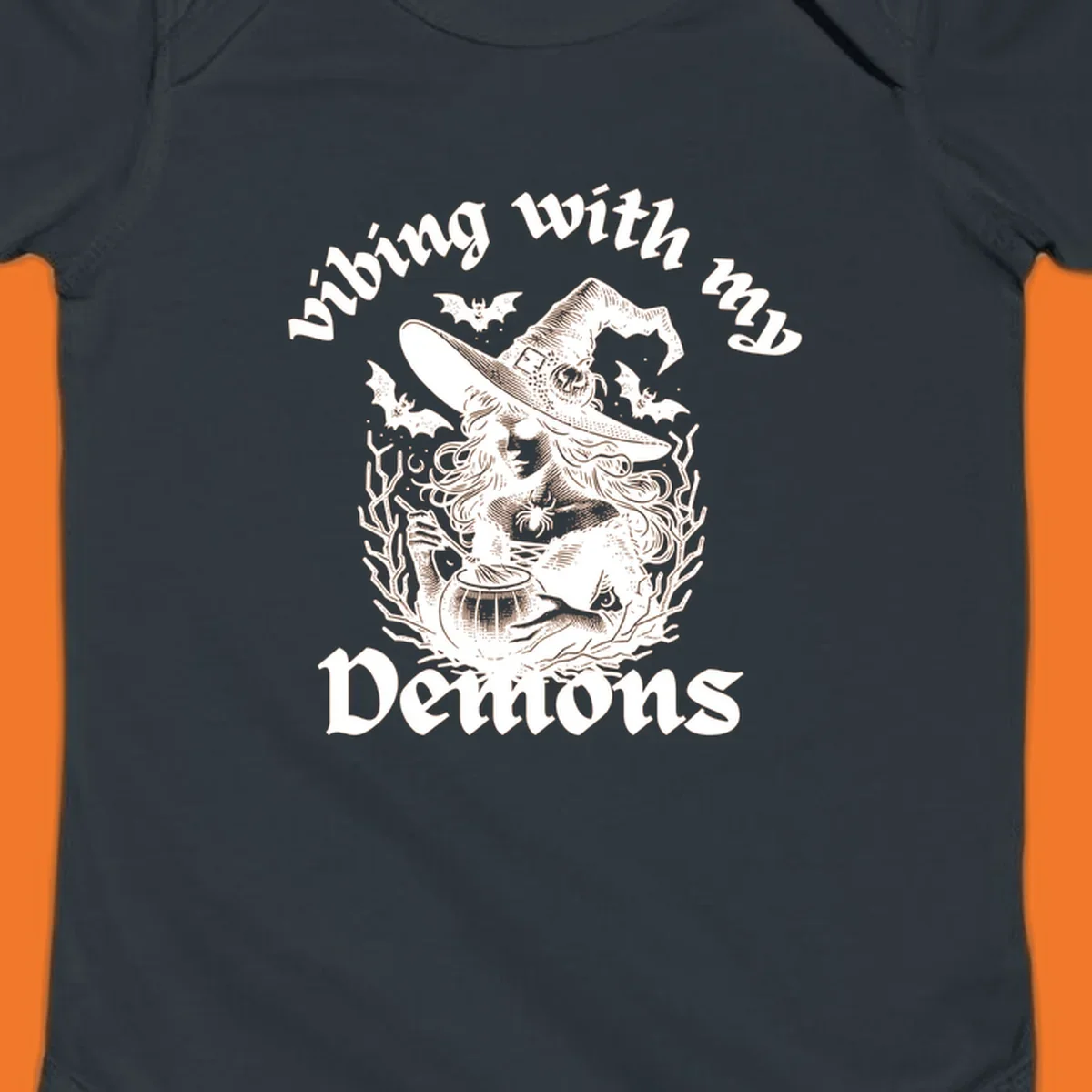 Witch stirring cauldron with bats and text 'vibing with my Demons', witch-vibing-demons design