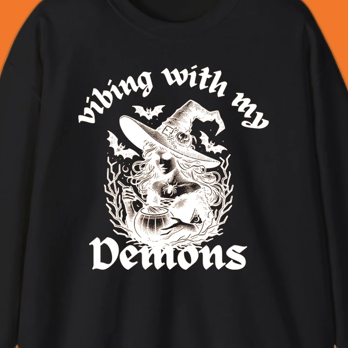 Witch stirring cauldron with bats and text 'vibing with my Demons', witch-vibing-demons design