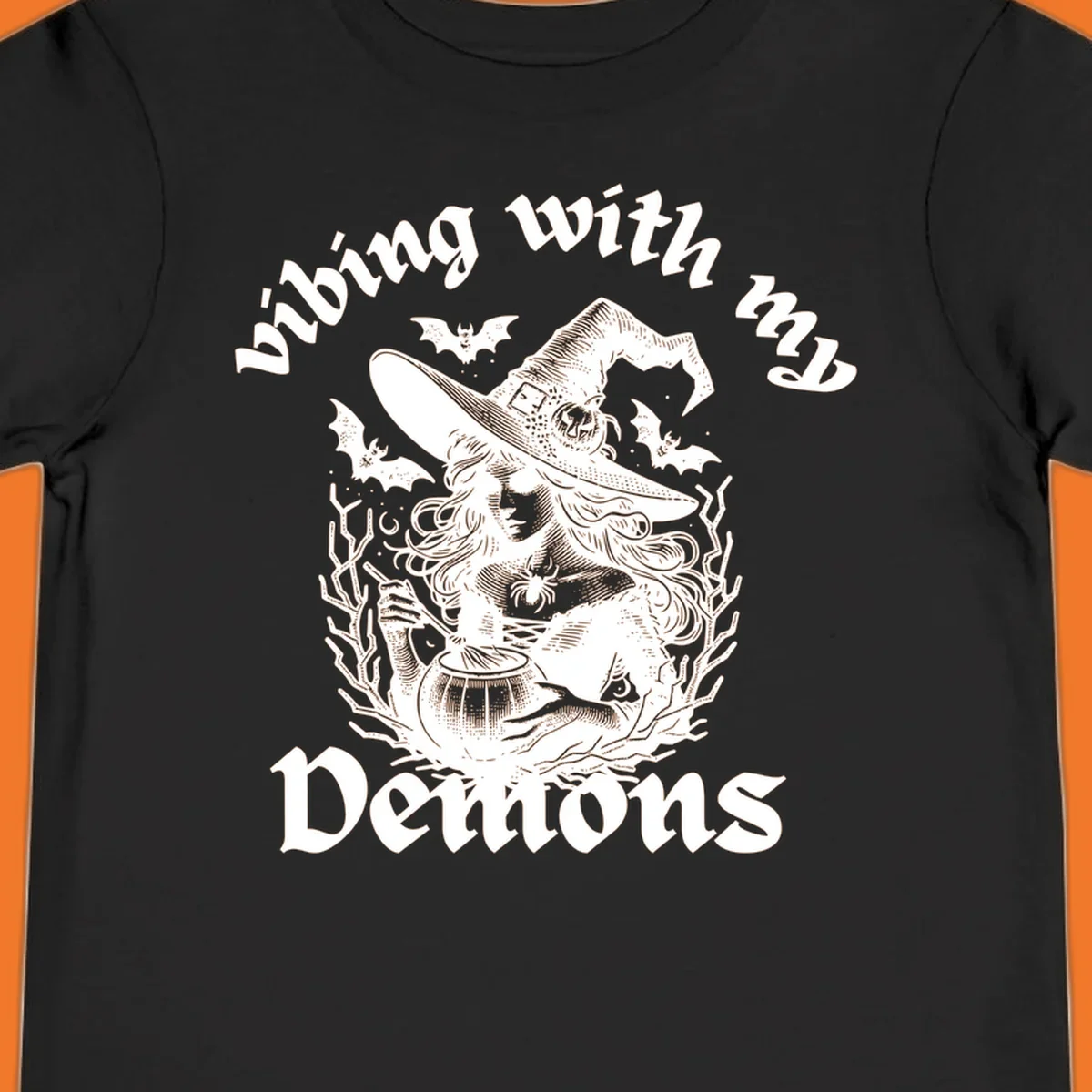 Witch stirring cauldron with bats and text 'vibing with my Demons', witch-vibing-demons design