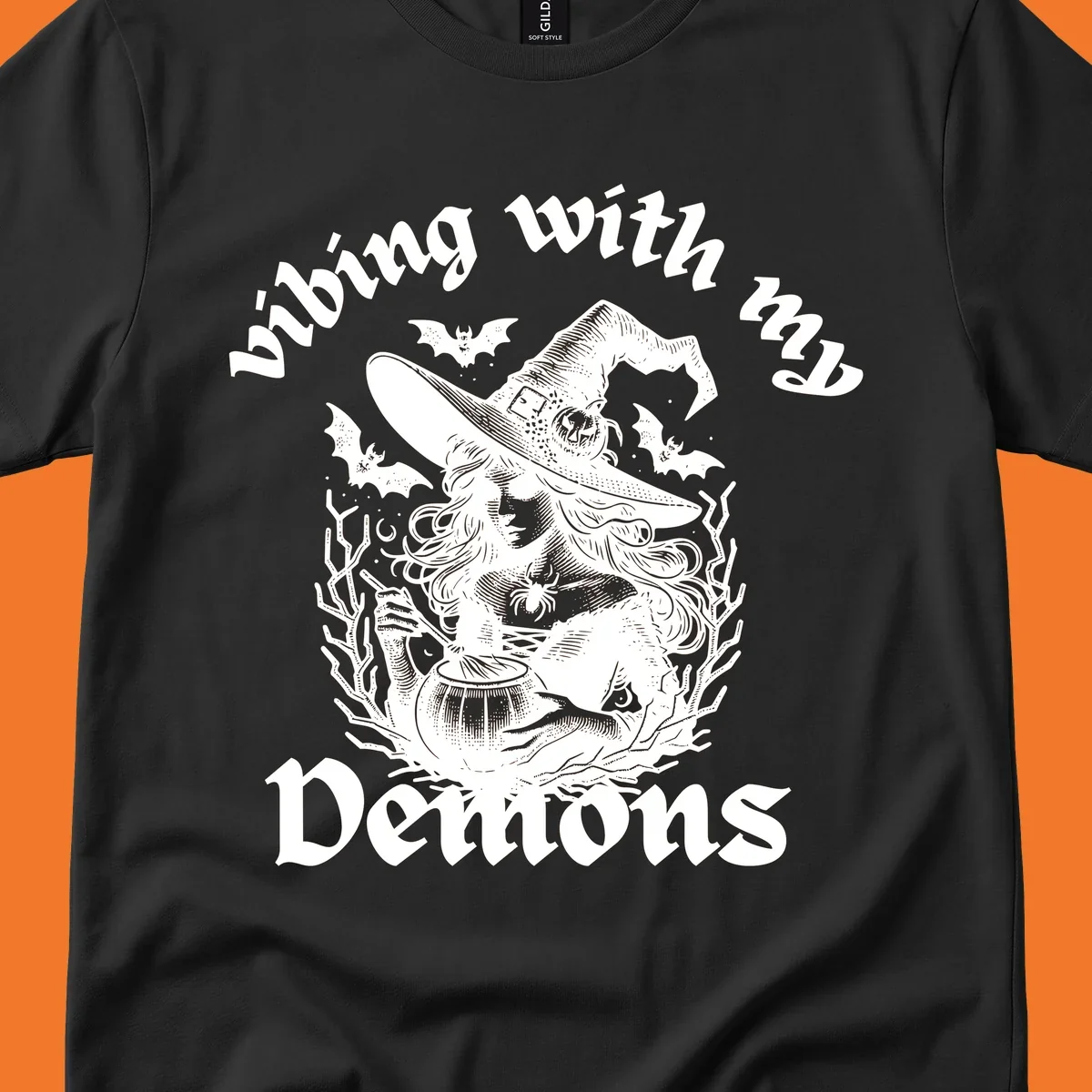 Witch stirring cauldron with bats and text 'vibing with my Demons', witch-vibing-demons design
