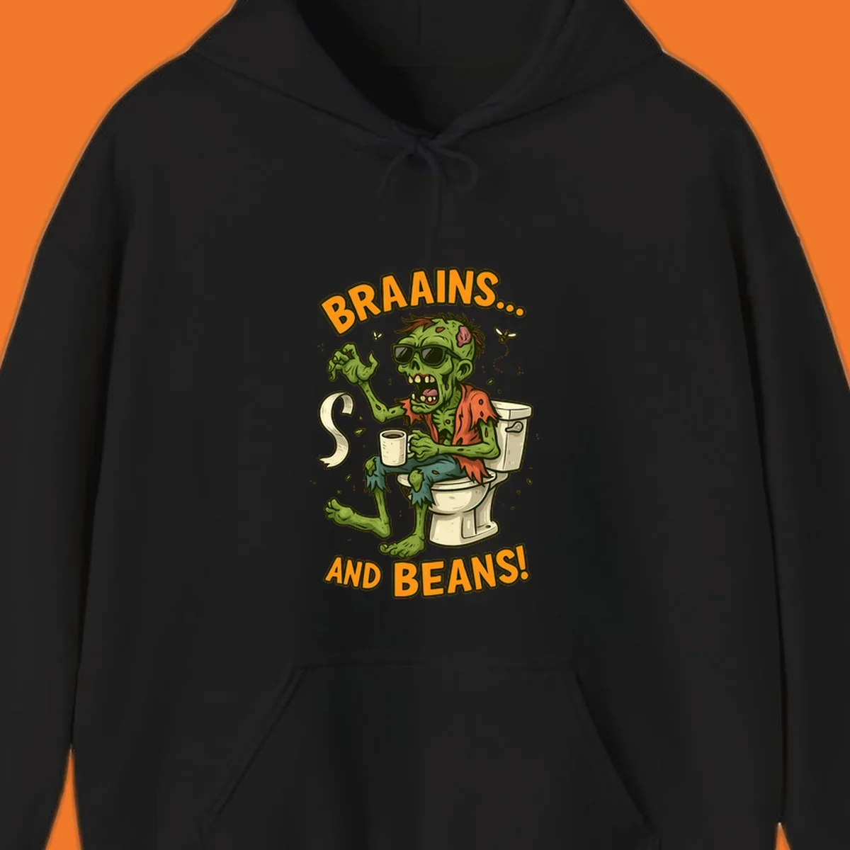 Zombie sitting on a toilet with coffee and toilet paper, text 'BRAAINS... AND BEANS!'.