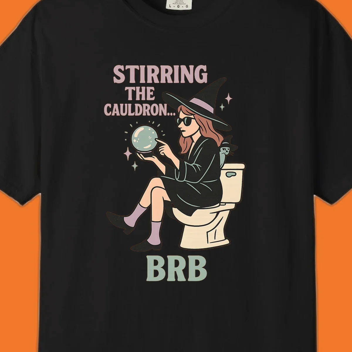 Witch sitting on toilet with crystal ball, text says Stirring The Cauldron BRB.