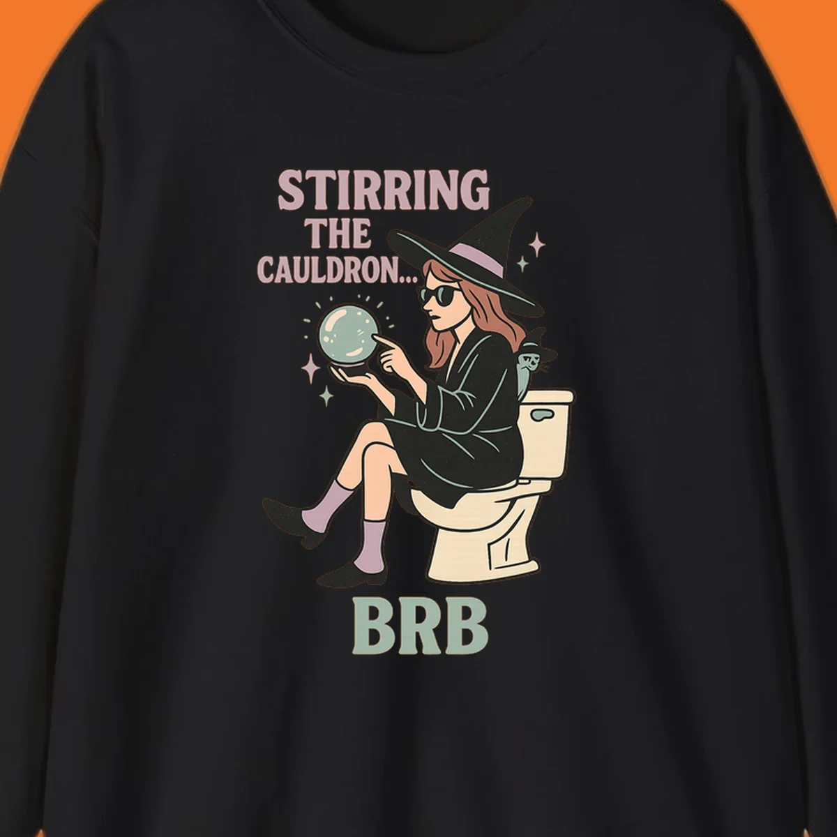 Witch sitting on toilet with crystal ball, text says Stirring The Cauldron BRB.