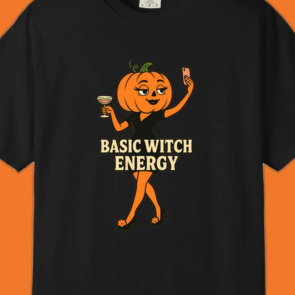 Pumpkin character with 'BASIC WITCH ENERGY' text, holding a cocktail and phone for a selfie.