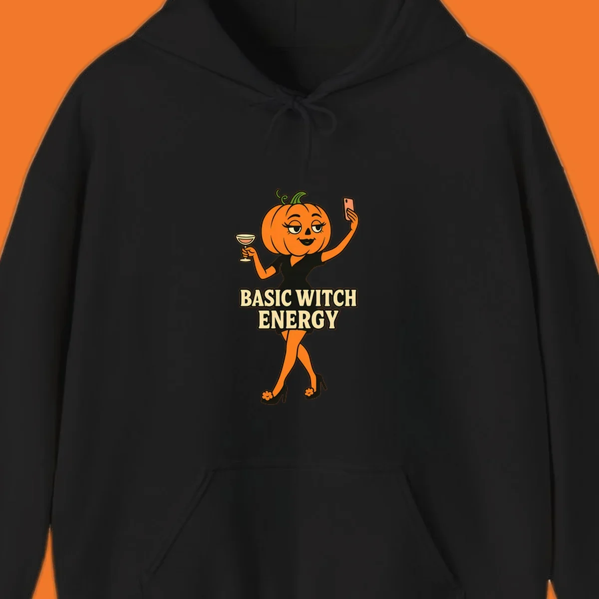 Pumpkin character with 'BASIC WITCH ENERGY' text, holding a cocktail and phone for a selfie.