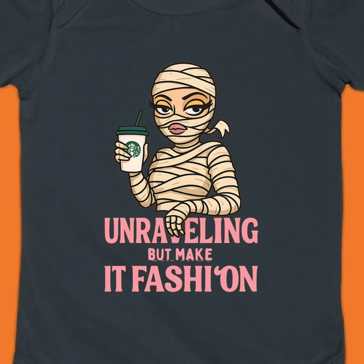 Mummy holding coffee cup with 'Unraveling But Make It Fashion' text. Mummy-fashion-coffee.