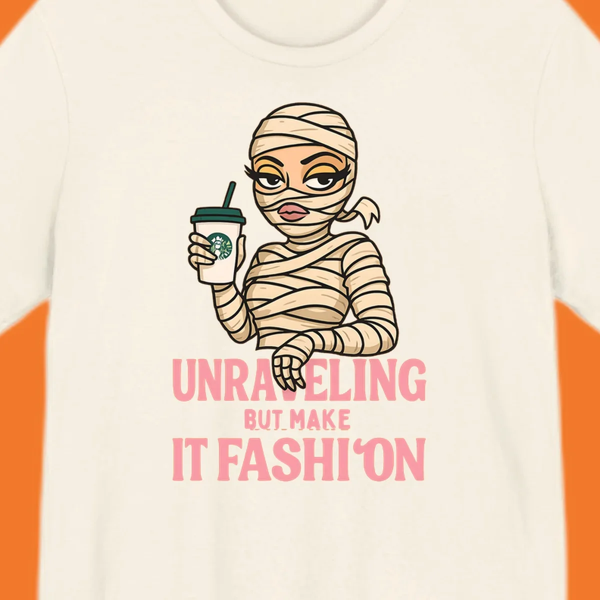 Mummy holding coffee cup with 'Unraveling But Make It Fashion' text. Mummy-fashion-coffee.