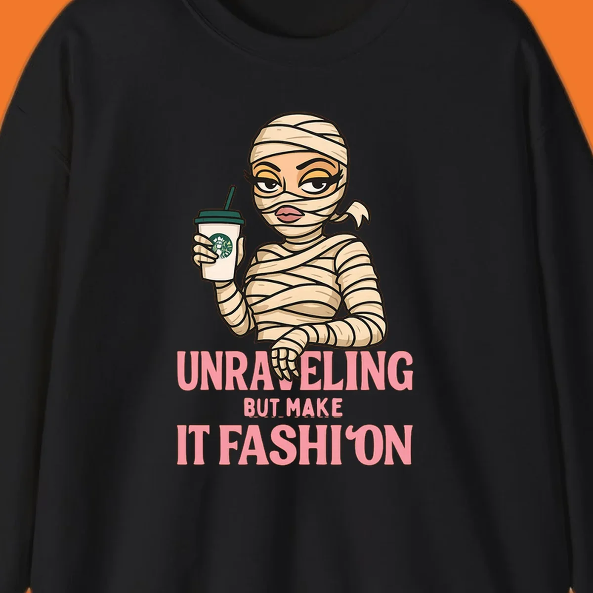 Mummy holding coffee cup with 'Unraveling But Make It Fashion' text. Mummy-fashion-coffee.