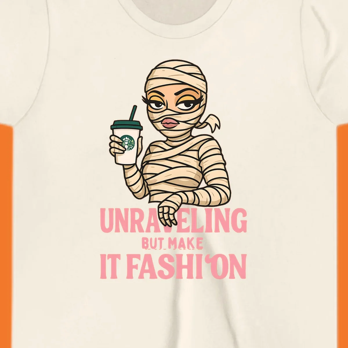 Mummy holding coffee cup with 'Unraveling But Make It Fashion' text. Mummy-fashion-coffee.