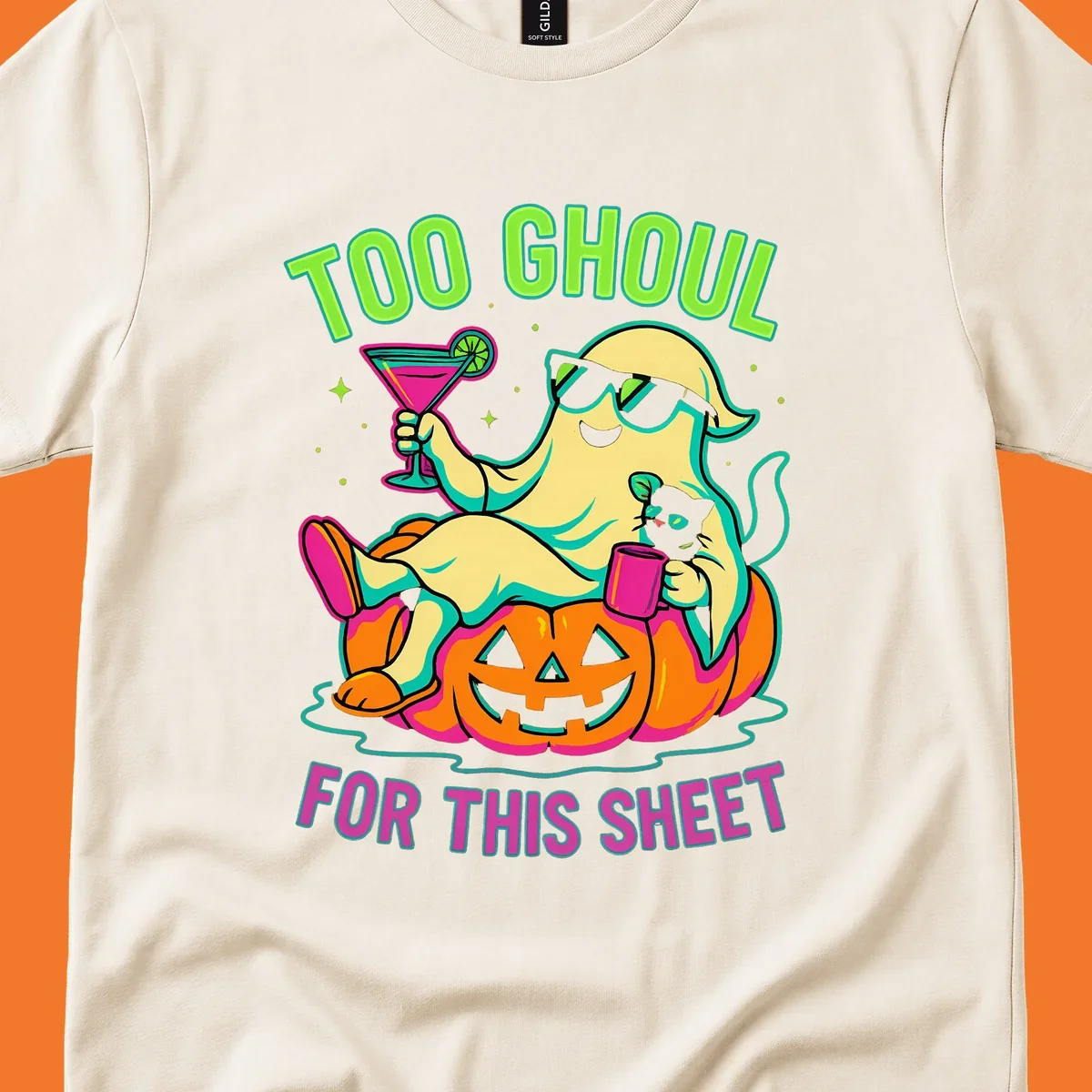 Ghost lounging on pumpkin with text 'Too Ghoul For This Sheet', Halloween design.