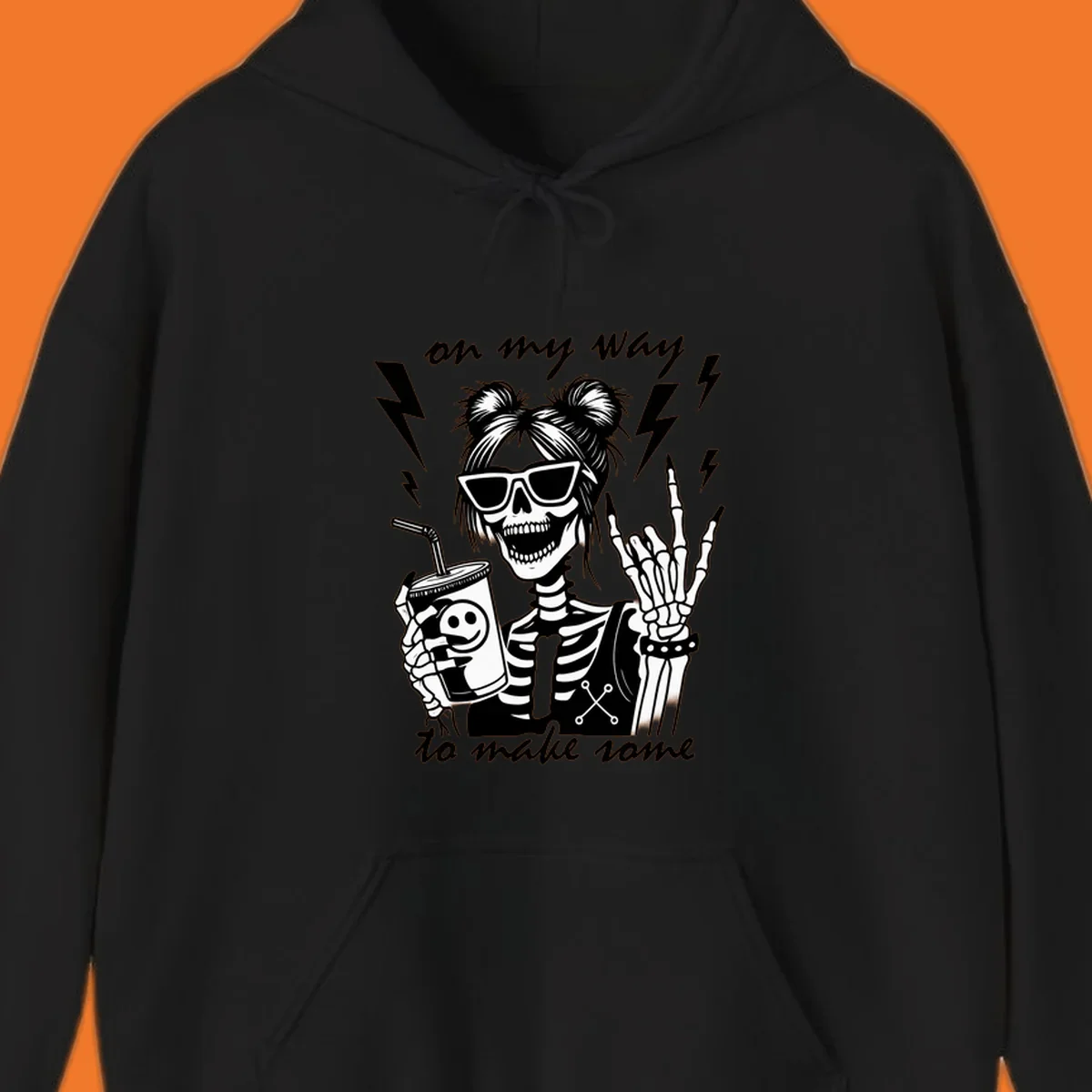 Skeleton with sunglasses and drink making rock-on gesture, text 'on my way to make some', lightning bolts. Skeleton party time.