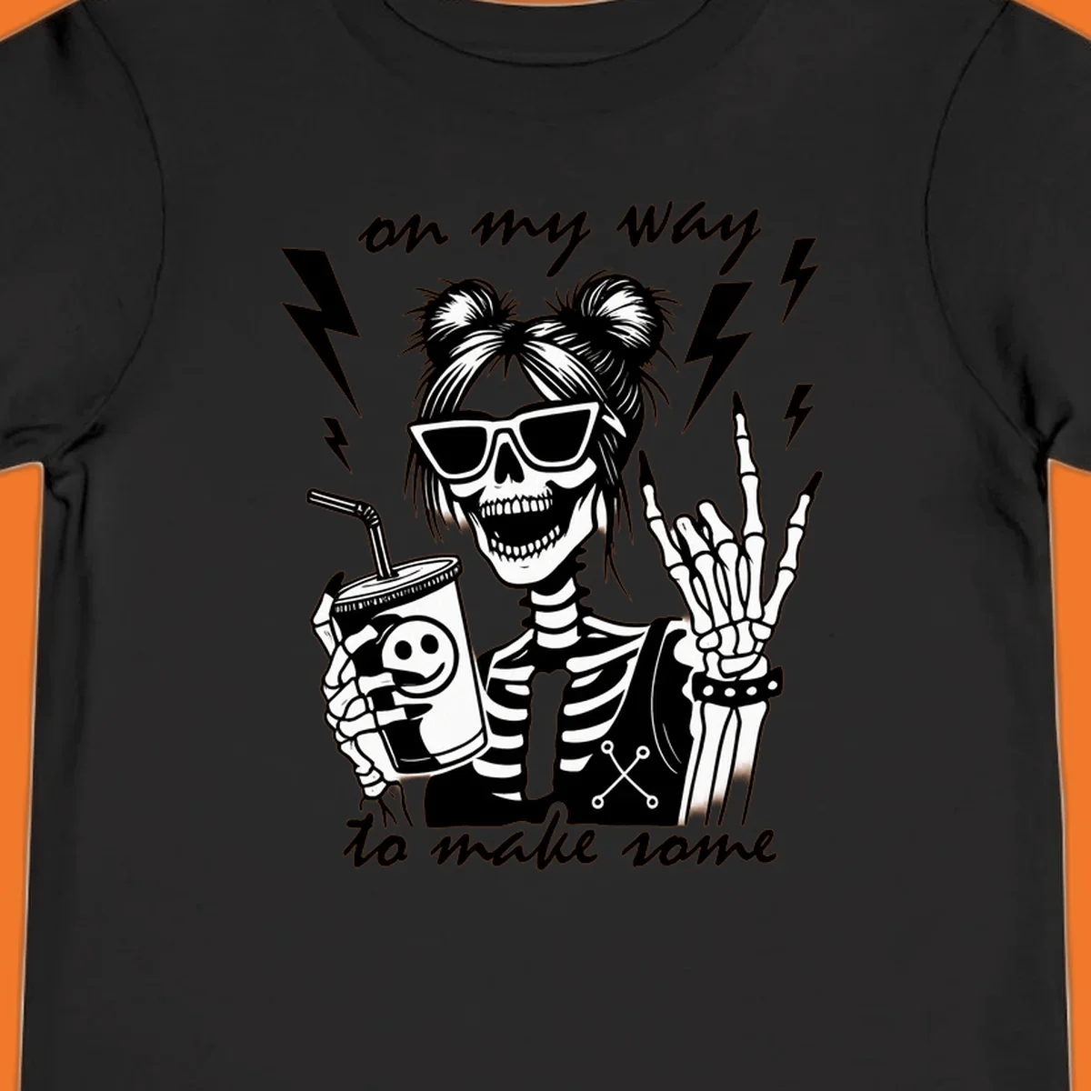 Skeleton with sunglasses and drink making rock-on gesture, text 'on my way to make some', lightning bolts. Skeleton party time.
