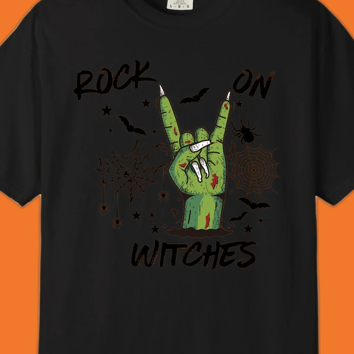 Zombie hand making rock on gesture with bats, spiders, and text 'ROCK ON WITCHES'.