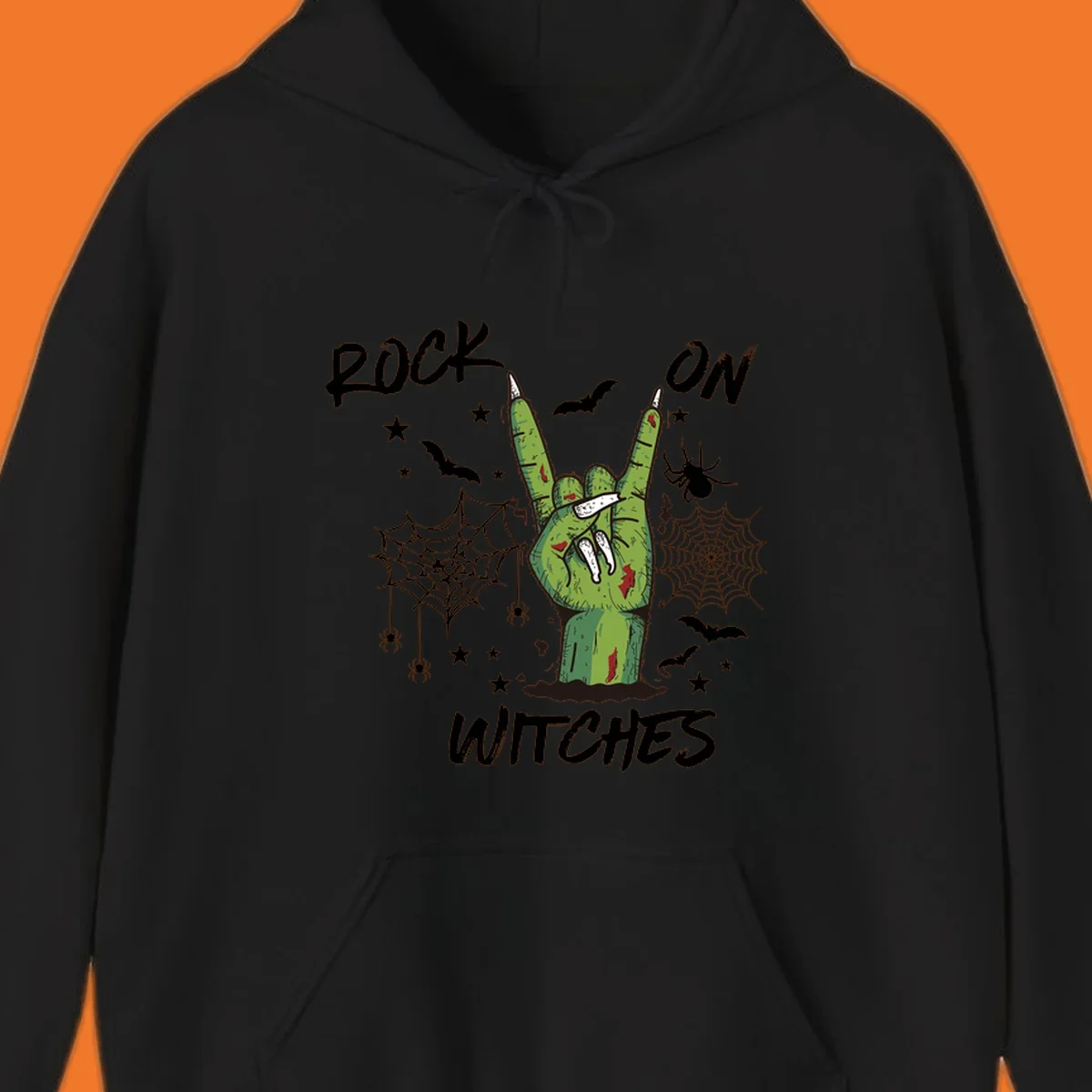 Zombie hand making rock on gesture with bats, spiders, and text 'ROCK ON WITCHES'.