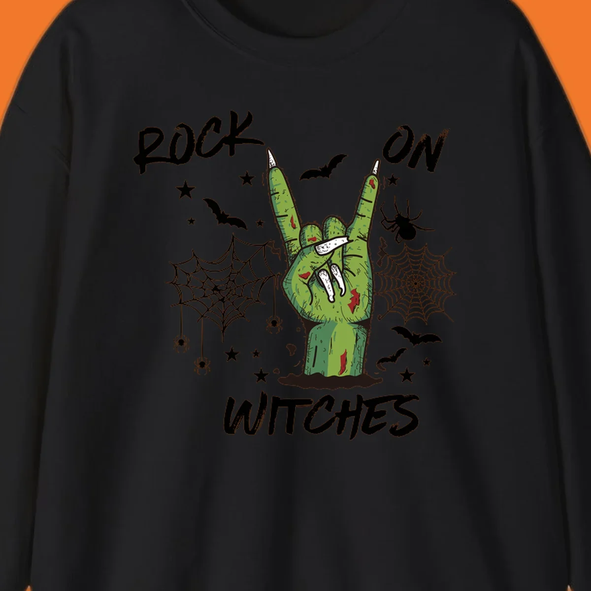 Zombie hand making rock on gesture with bats, spiders, and text 'ROCK ON WITCHES'.