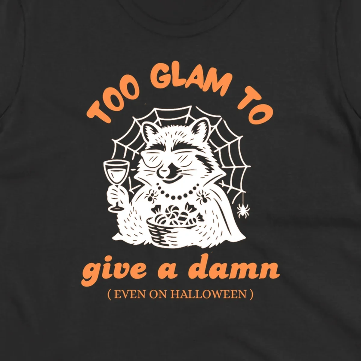 Glam raccoon with sunglasses and wine, 'Too Glam To Give A Damn' text for Halloween.