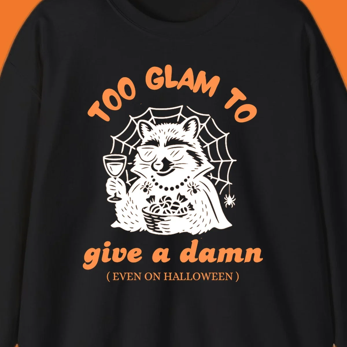 Glam raccoon with sunglasses and wine, 'Too Glam To Give A Damn' text for Halloween.