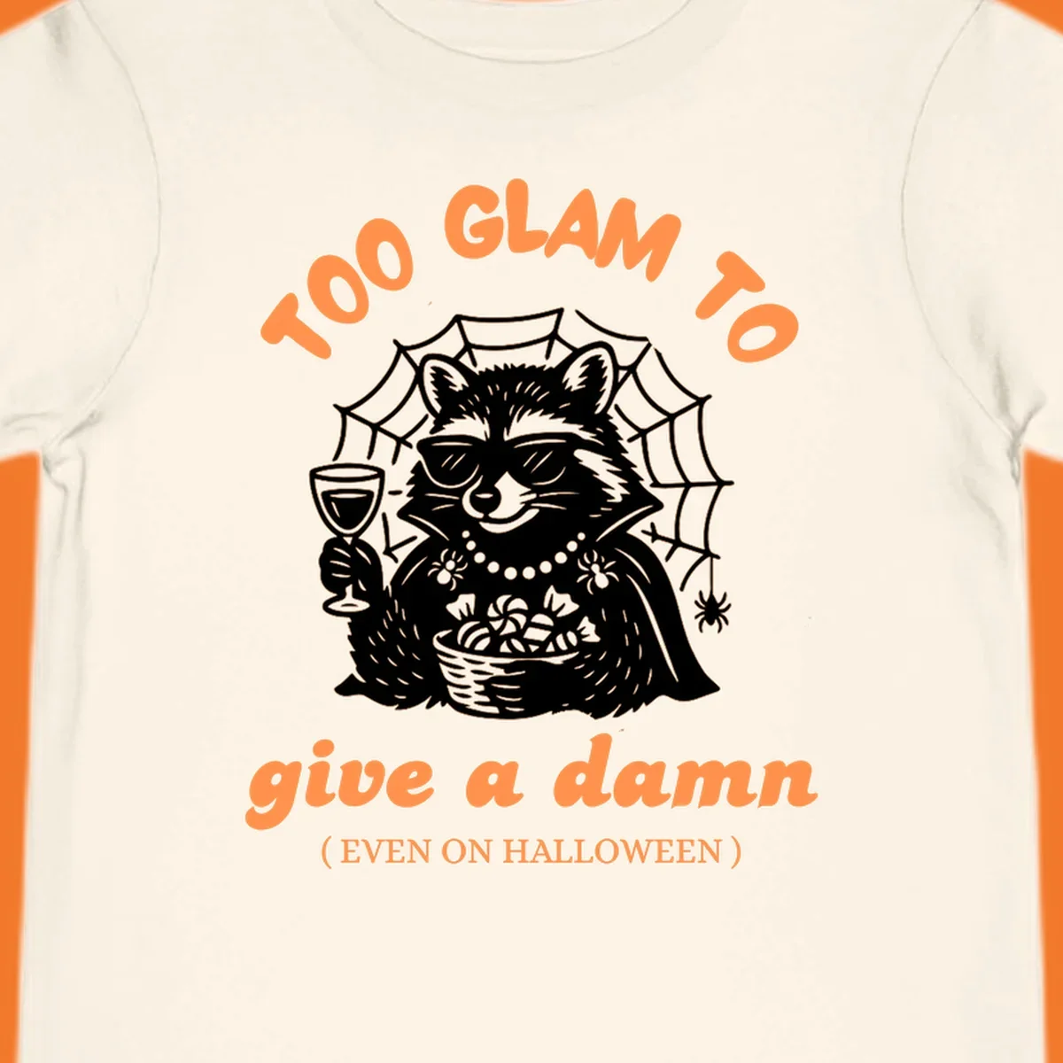 Glam raccoon with sunglasses and wine, 'Too Glam To Give A Damn' text for Halloween.